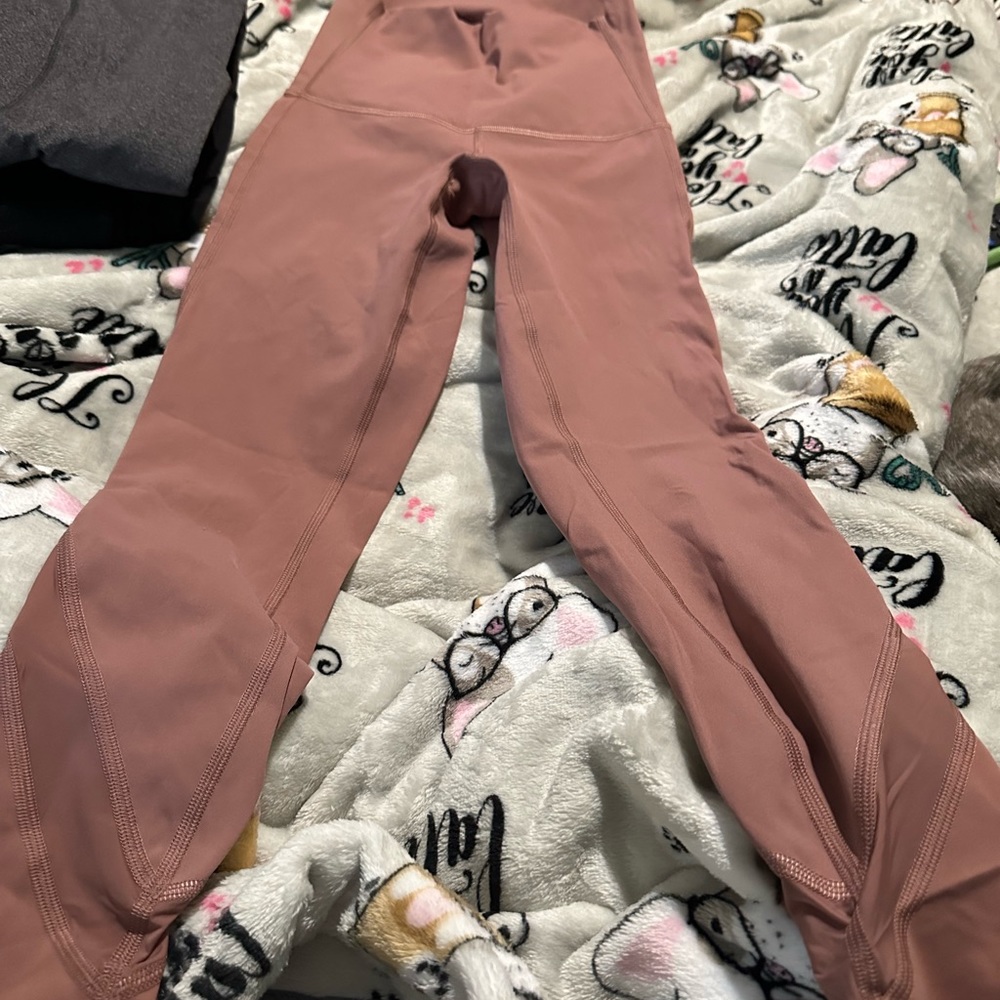 Size 0 lulu lemon crop light pink leggings new worn maybe once doesn’t have tags